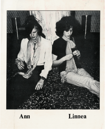Ann and Linnea leaning against a tree